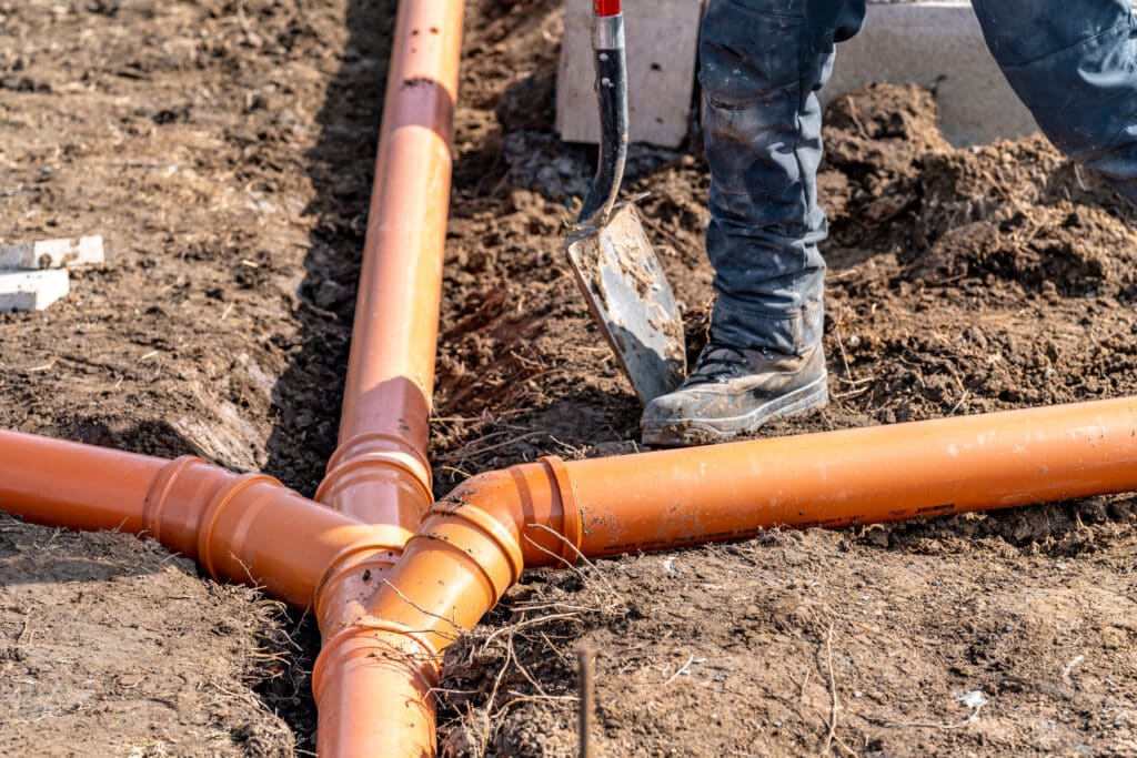 installation of a sewage plastic pipe during the construction of a house